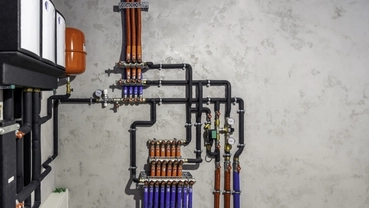Smart water control system with pipes, valves and monitoring equipment installed indoors