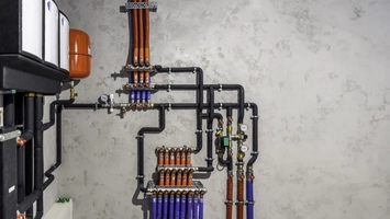 Smart water control system with pipes, valves and monitoring equipment installed indoors