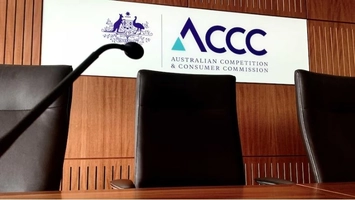 ACCC hearing room with commission logo