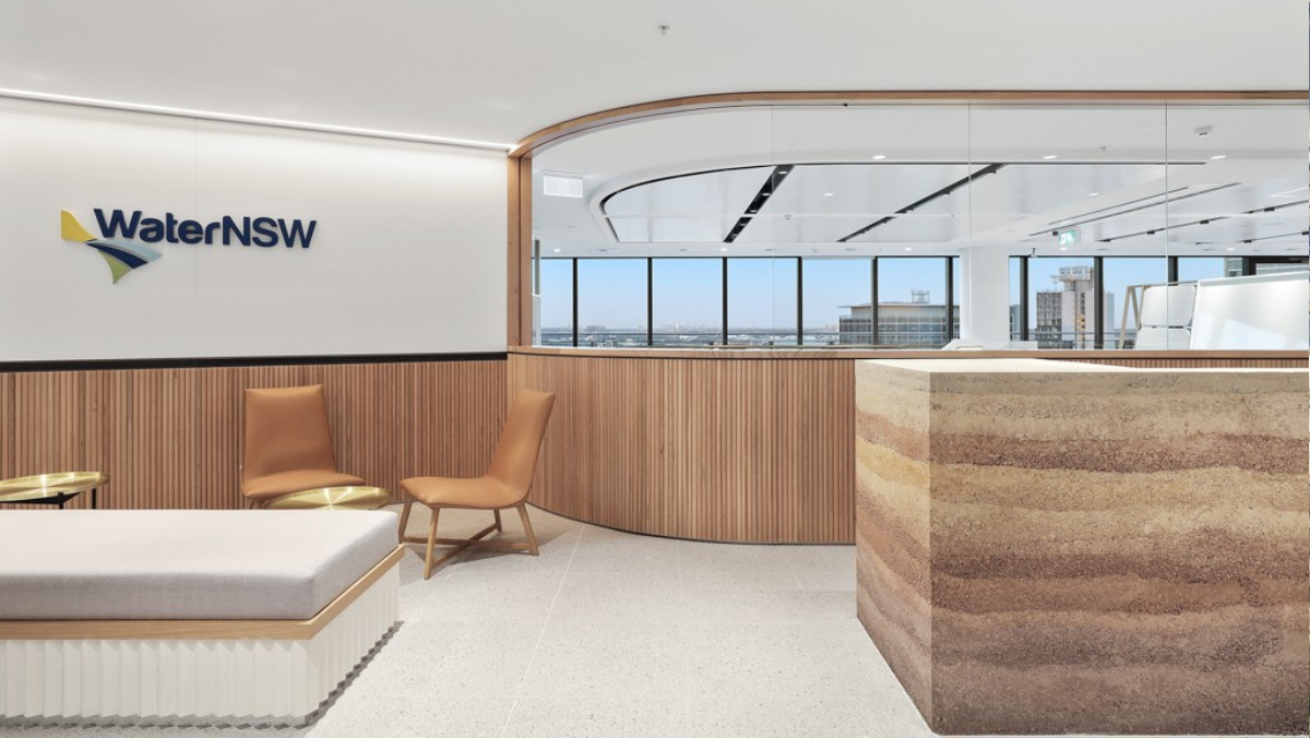 Modern WaterNSW office interior with timber panels, chairs and large windows.