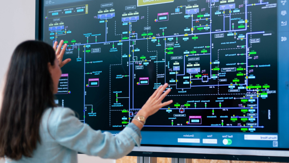 Operator monitoring water network data on digital control dashboard