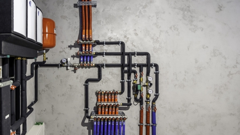 Smart water control system with pipes, valves and monitoring equipment installed indoors